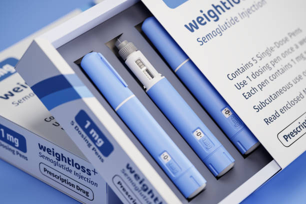 Open box displaying blue weight-loss injector pens and packaging labeled WeightLoss+.
