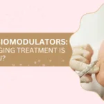 Banner showing a cosmetic treatment scene with a woman's face receiving an injection on the right; title reads 'FILLERS VS BIOMODULATORS: WHICH ANTI-AGING TREATMENT IS RIGHT FOR YOU?'. This communicates a comparison of anti-aging options.